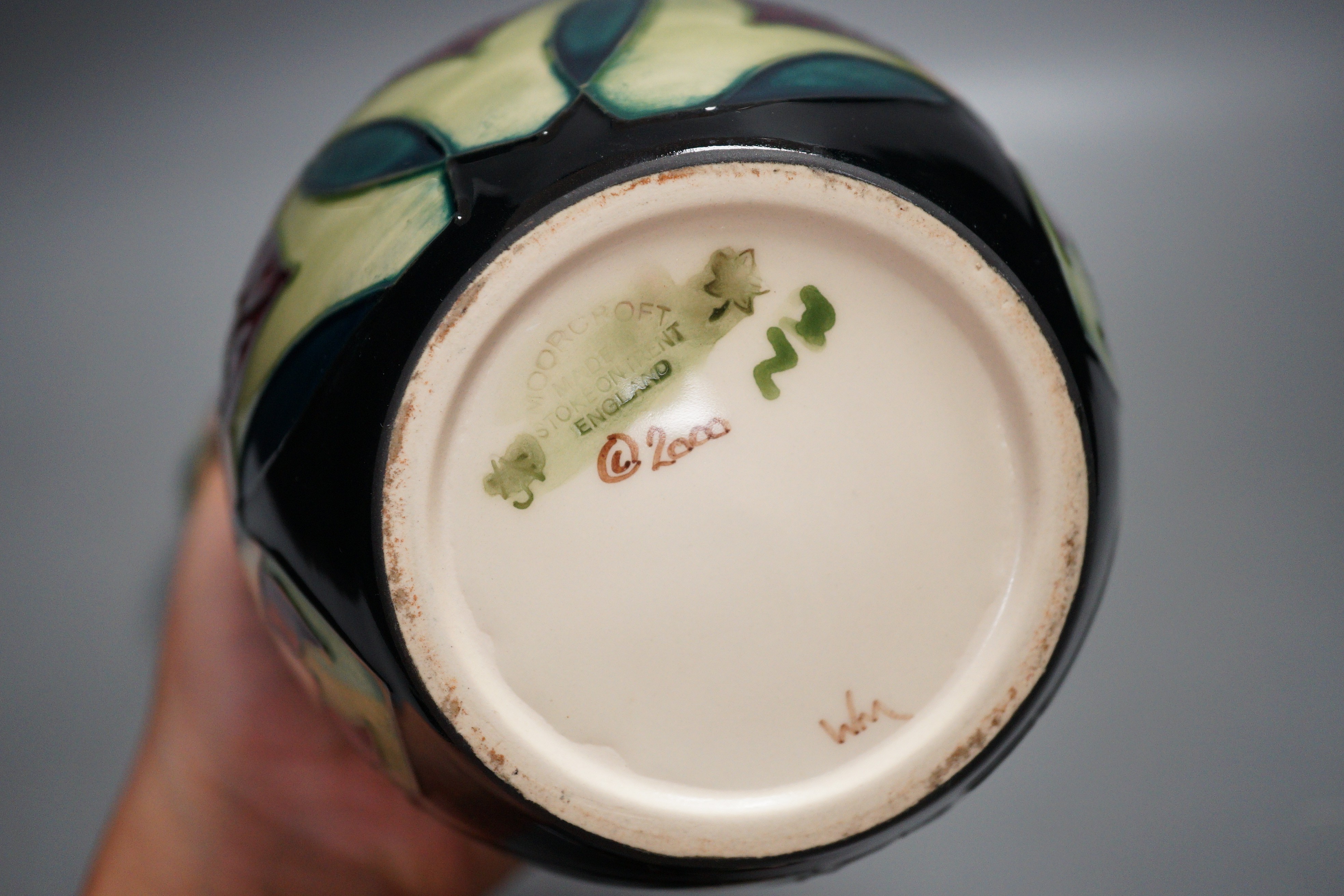 A Moorcroft pottery squat shaped vase and lidded ginger jar, decorated in the 